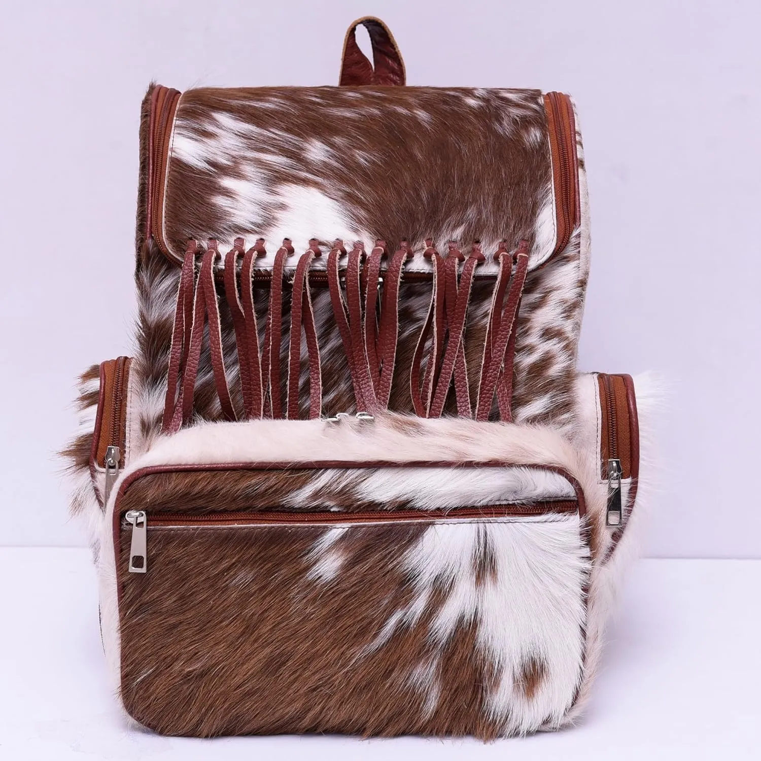 CHAYELL Luxury Real Cowhide Backpack for Women & Men  Hair-On Leather Cow Diaper Bag with Fringe | Handmade Artisan Cow Print Laptop Backpack for Travel, Work & Motherhood | Western Rucksack Knapsack